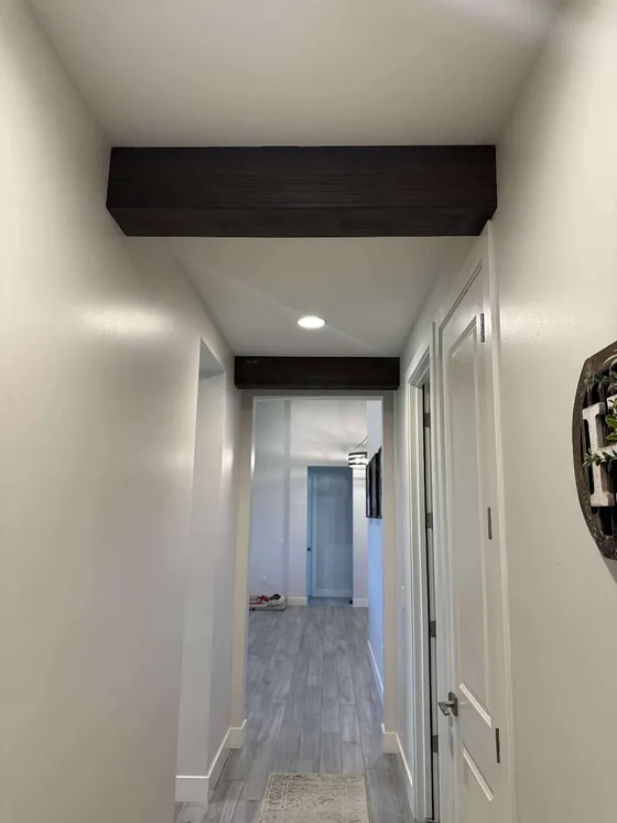 Box beam headers mark the hallway ceiling