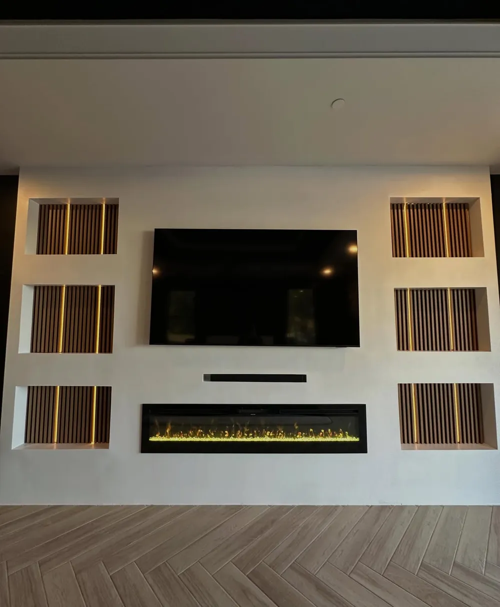 Backlit slat media wall with linear fireplace