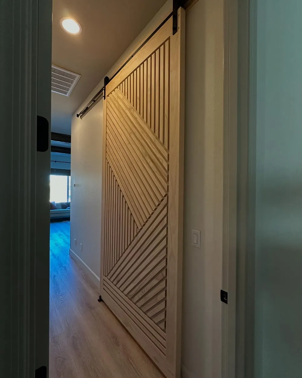Framed by two doorways, the same slider leads toward daylight.